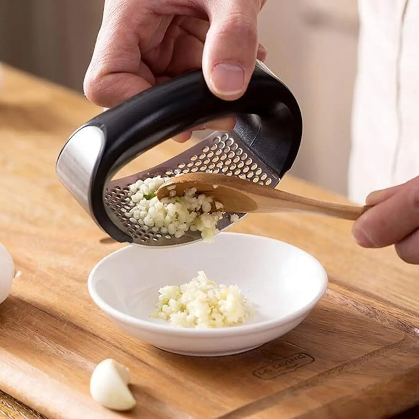 Rocker-style garlic press