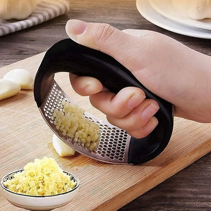 Rocker-style garlic press