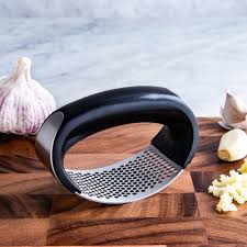 Rocker-style garlic press